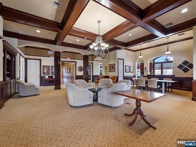 living room featuring ornate columns, visible vents, arched walkways, and beamed ceiling