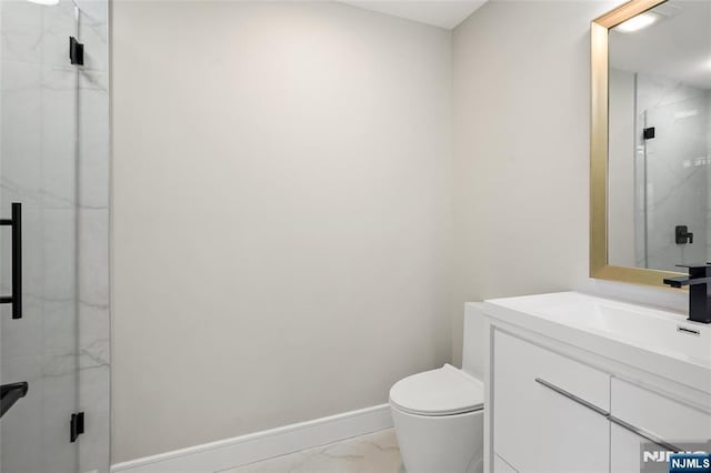 bathroom featuring toilet, vanity, baseboards, marble finish floor, and a marble finish shower