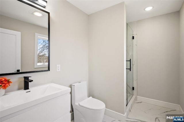 full bathroom with marble finish floor, a marble finish shower, toilet, vanity, and baseboards