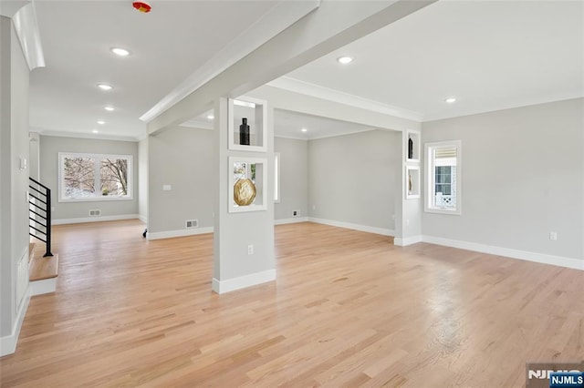 unfurnished living room featuring light wood-style floors, stairs, baseboards, and recessed lighting