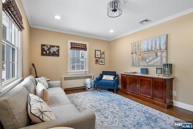 interior space featuring a wealth of natural light, visible vents, and radiator heating unit