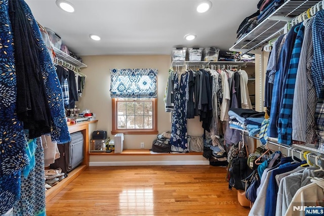 spacious closet with wood finished floors