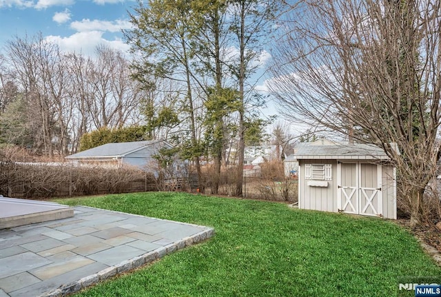 view of yard featuring a storage shed and an outdoor structure