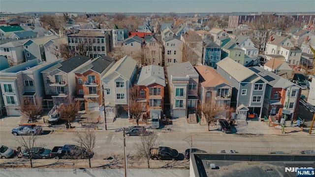 birds eye view of property with a residential view