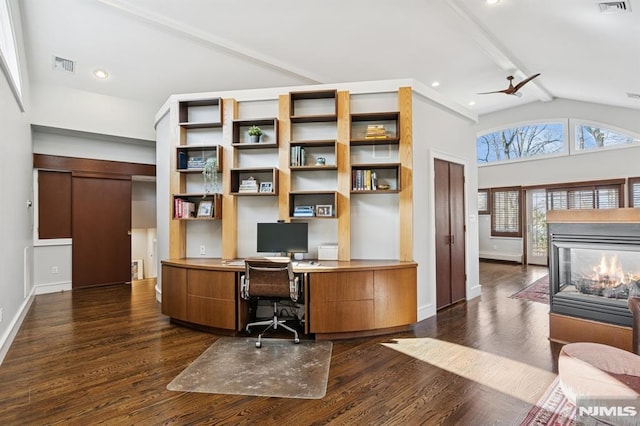 office featuring dark wood-style floors, baseboards, visible vents, and high vaulted ceiling