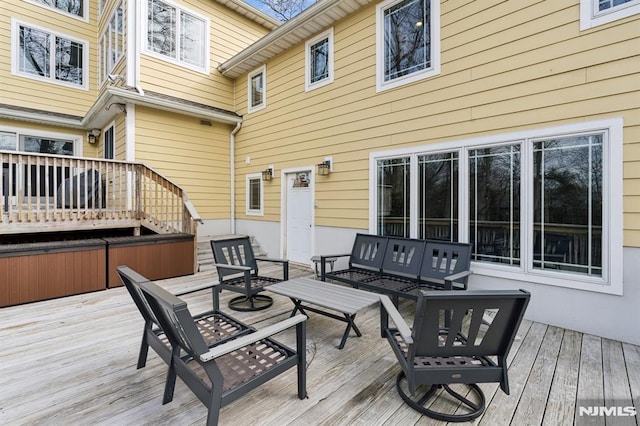 deck featuring outdoor lounge area