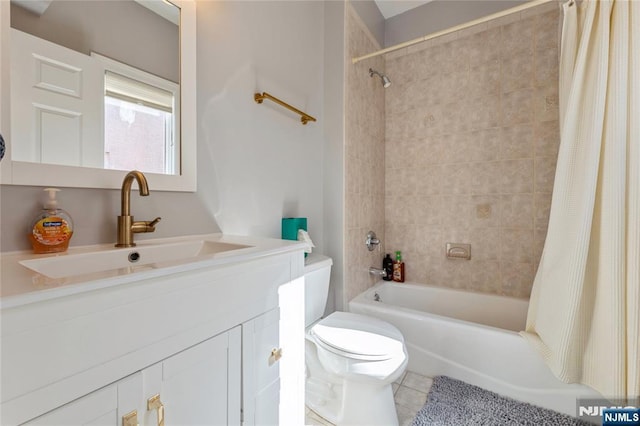 full bathroom with tile patterned floors, vanity, toilet, and shower / bathtub combination with curtain