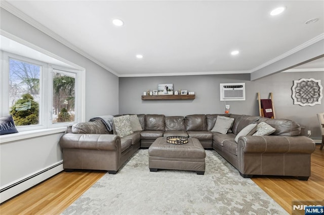 living area featuring an AC wall unit, ornamental molding, a baseboard radiator, and wood finished floors