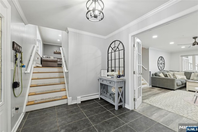 entrance foyer with stairs, ornamental molding, a baseboard radiator, and baseboards