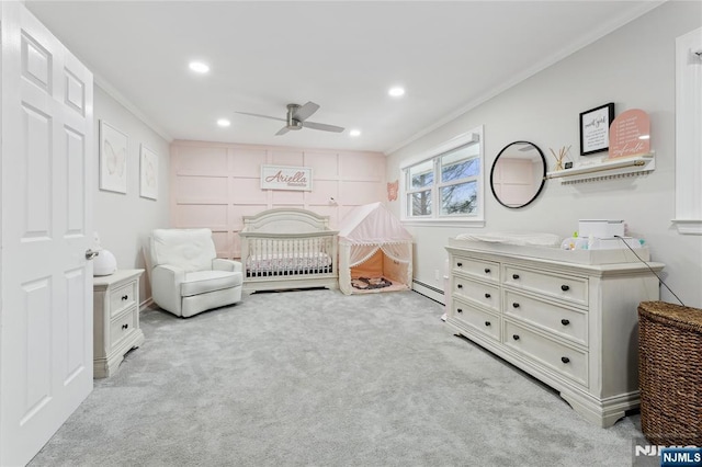 bedroom featuring recessed lighting, a baseboard heating unit, crown molding, and light colored carpet