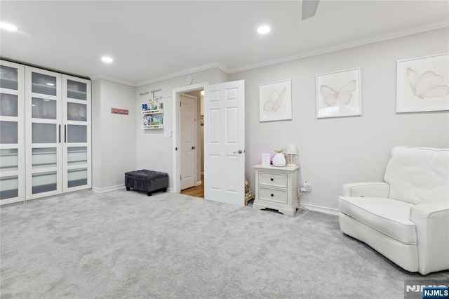 living area with carpet, crown molding, baseboards, and recessed lighting