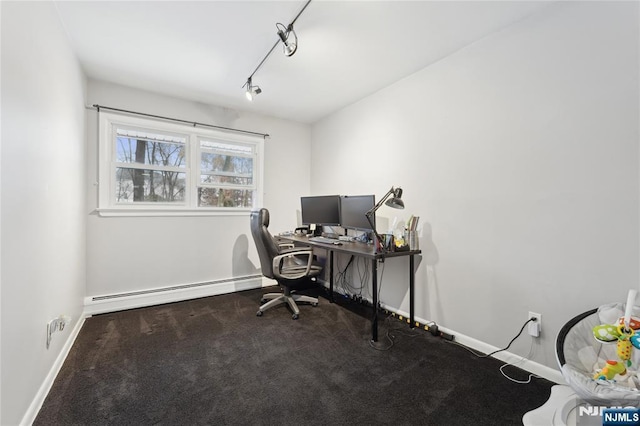 office featuring carpet flooring, rail lighting, baseboards, and baseboard heating