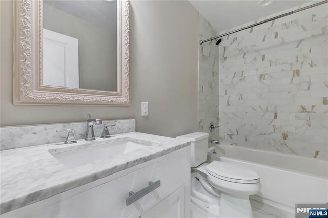 bathroom with toilet, marble finish floor, shower / washtub combination, and vanity