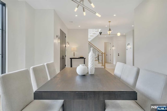 dining area featuring stairway, recessed lighting, and a notable chandelier