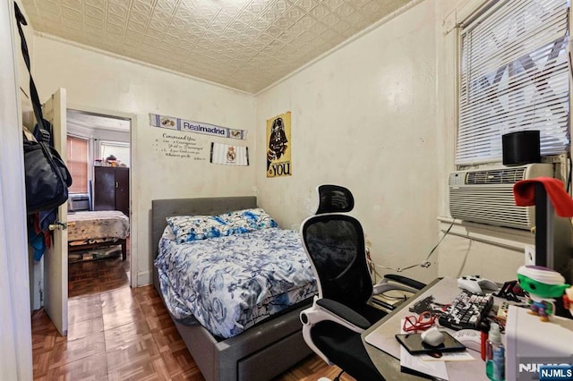 bedroom featuring ornamental molding, cooling unit, and an ornate ceiling