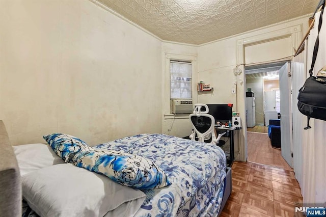 bedroom featuring an ornate ceiling and crown molding