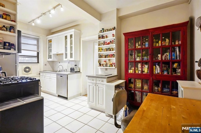 kitchen with open shelves, tasteful backsplash, white cabinets, light tile patterned flooring, and dishwasher