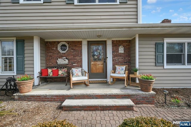 entrance to property featuring a porch