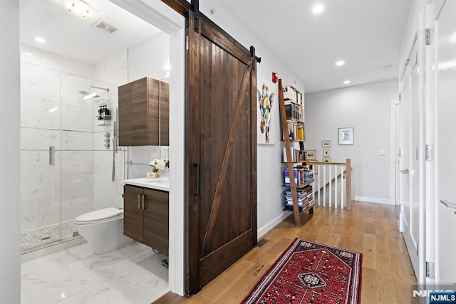 bathroom with visible vents, baseboards, toilet, vanity, and recessed lighting