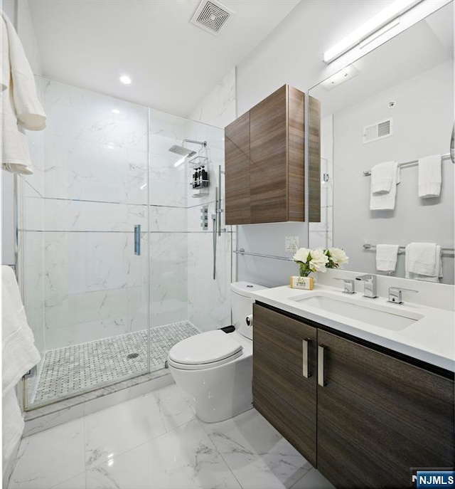 bathroom with toilet, marble finish floor, a marble finish shower, and visible vents