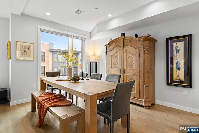 dining area featuring light wood-type flooring, visible vents, baseboards, and recessed lighting