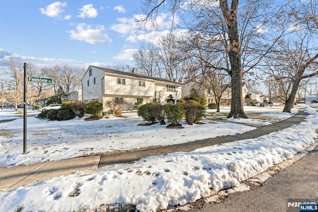 view of front of property with a chimney and a residential view