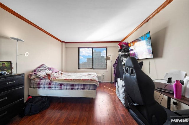 bedroom featuring ornamental molding and dark wood-style flooring