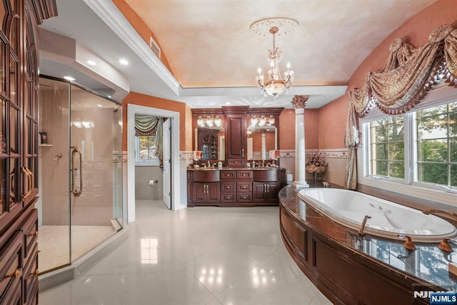 bathroom featuring a stall shower, decorative columns, wainscoting, tile patterned flooring, and vanity