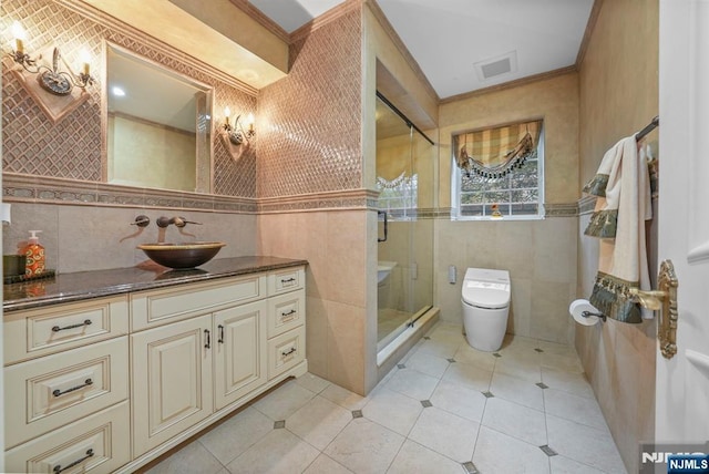 bathroom featuring visible vents, tile walls, toilet, and tile patterned floors