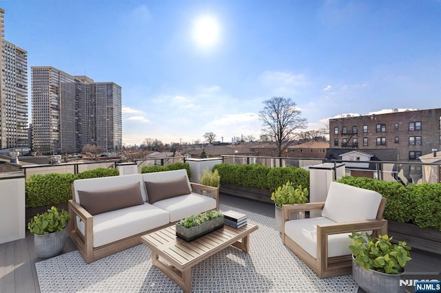 view of patio / terrace featuring a view of city and an outdoor hangout area