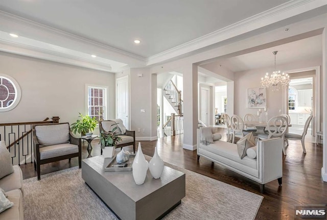 living area featuring dark wood-style floors, recessed lighting, stairs, and a chandelier