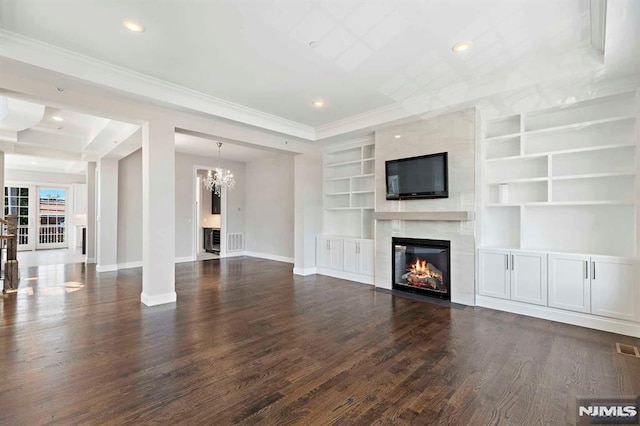 unfurnished living room with dark wood-style floors, a premium fireplace, recessed lighting, and baseboards