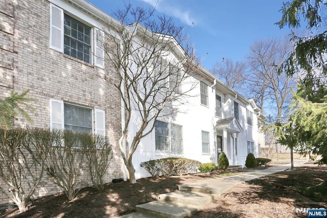 view of home's exterior featuring brick siding