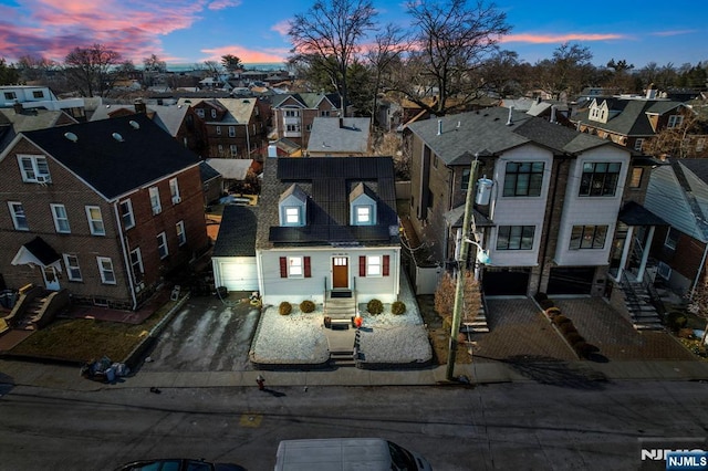 aerial view at dusk with a residential view