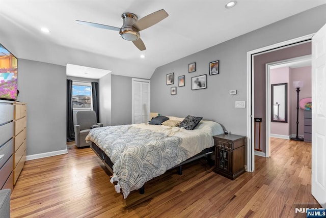 bedroom with light wood finished floors, baseboards, and recessed lighting