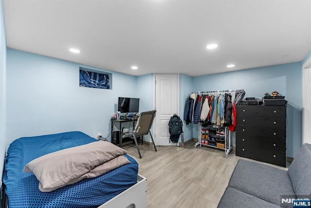 bedroom with light wood-type flooring and recessed lighting