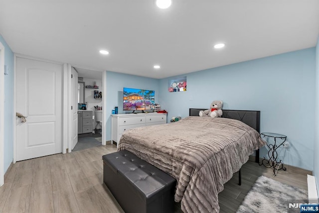 bedroom featuring light wood-style flooring and recessed lighting