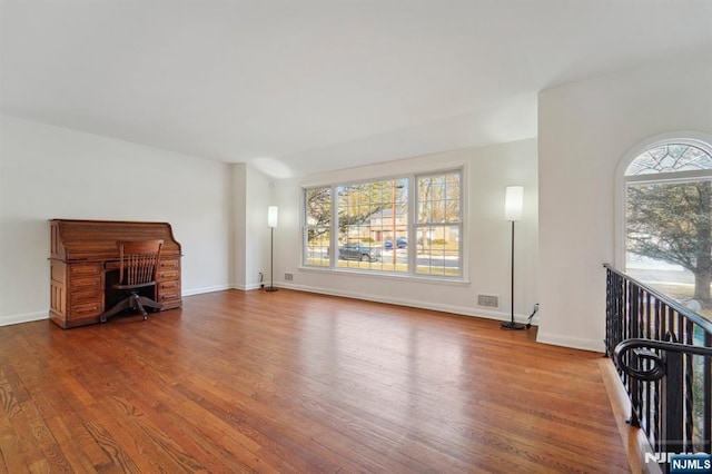 living room with wood finished floors and baseboards