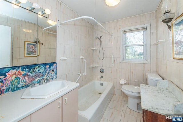 full bath with shower / bathing tub combination, tile walls, and vanity