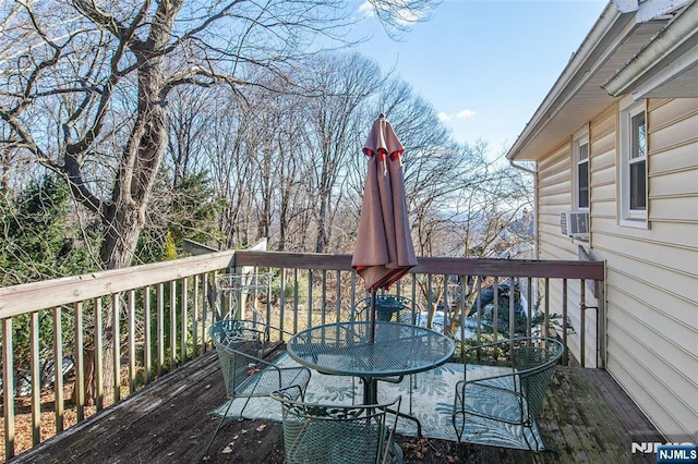 wooden deck featuring outdoor dining area