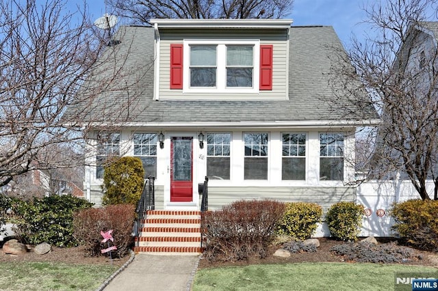 view of front of property with a shingled roof