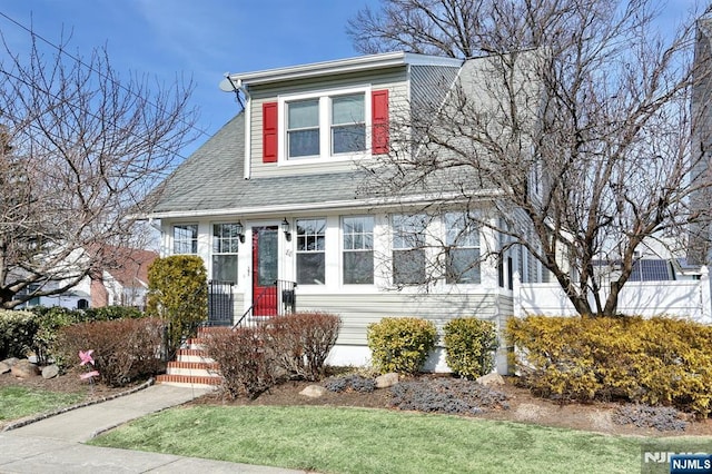 view of front of home featuring roof with shingles