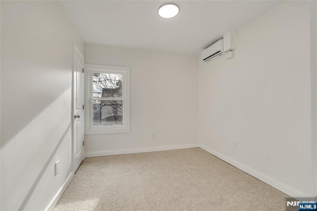 empty room with a wall mounted air conditioner and baseboards