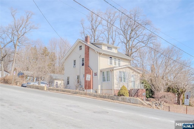 view of home's exterior with a chimney