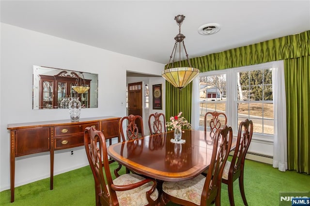 dining room featuring a baseboard heating unit, visible vents, and carpet flooring