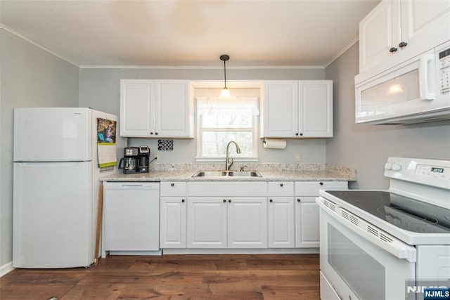 kitchen with ornamental molding, white appliances, a sink, and white cabinetry