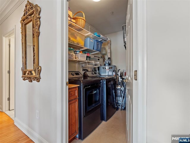 storage area with separate washer and dryer