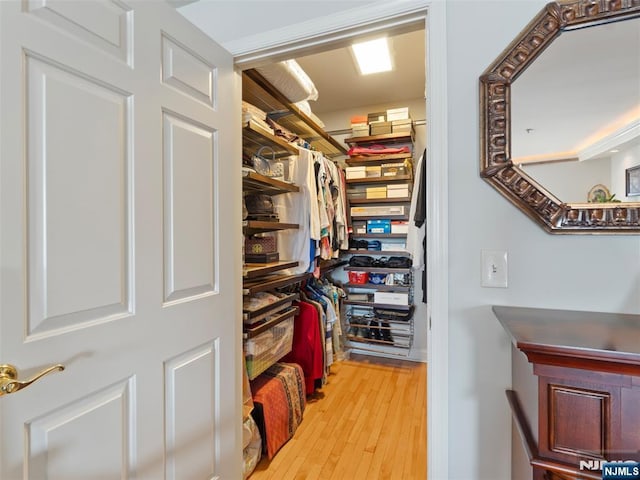 spacious closet with wood finished floors