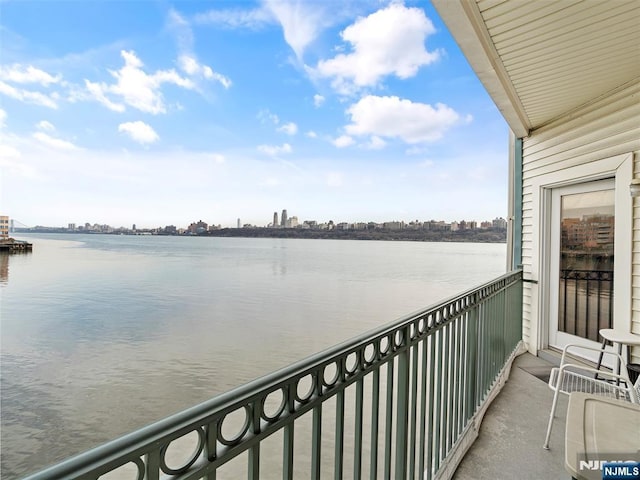 balcony featuring a water view