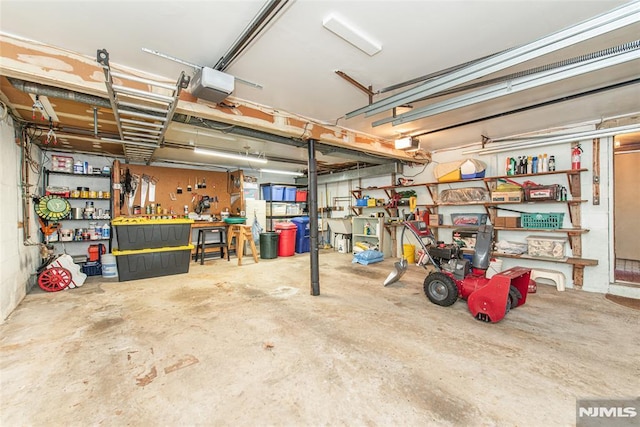 garage featuring a workshop area and a garage door opener